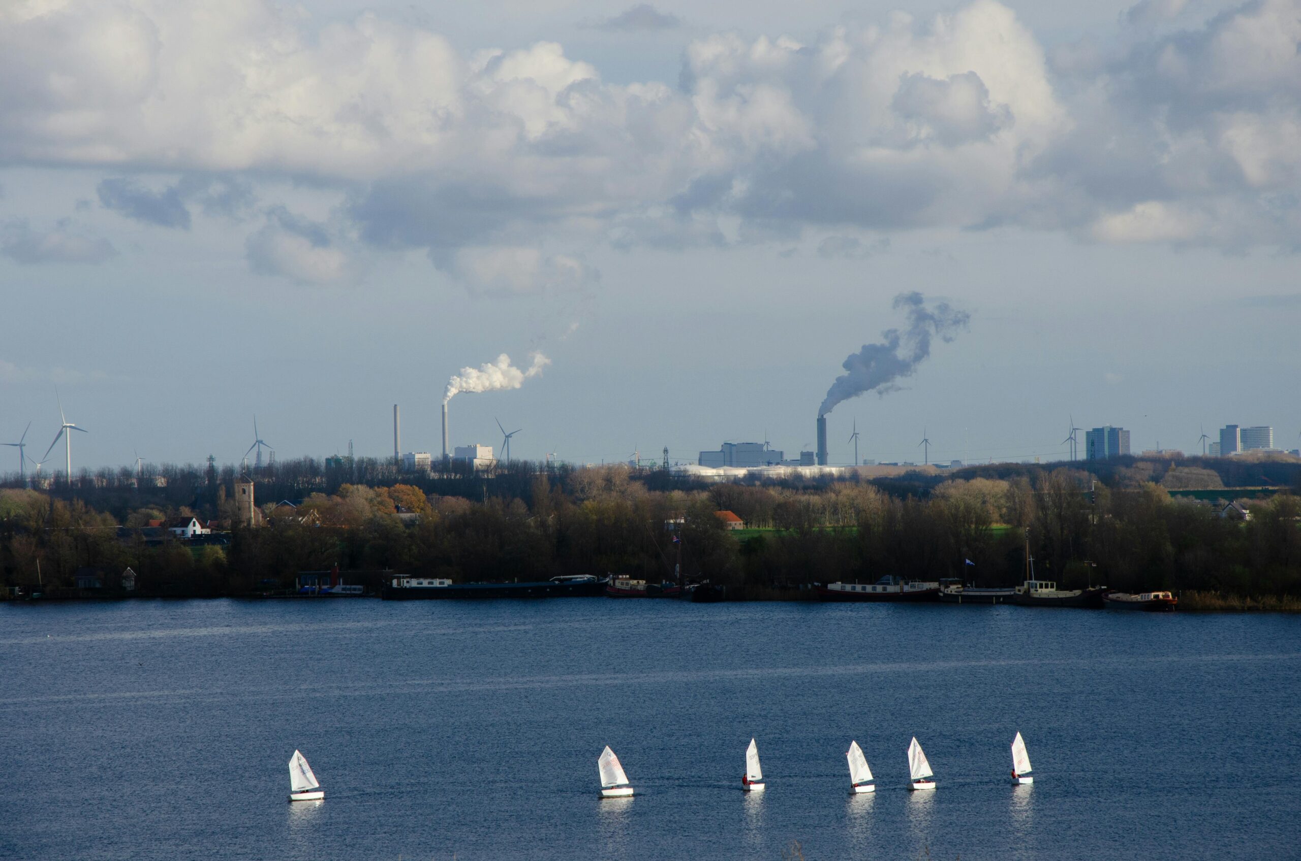 A factory emitting smoke into the environment causing pollution