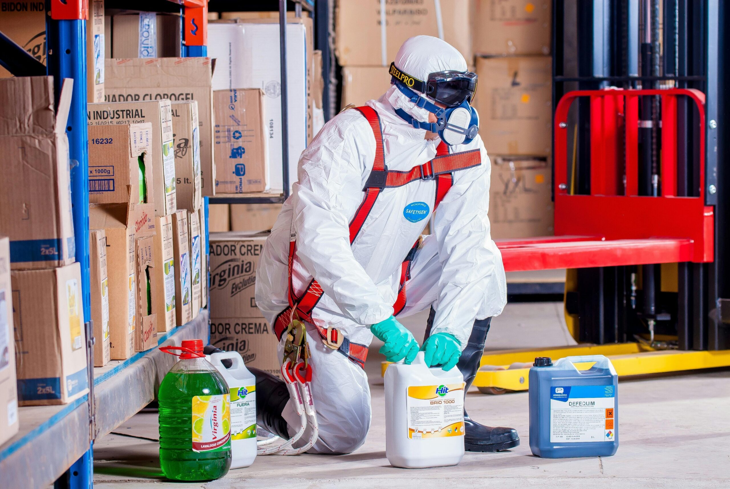 Warehouse workers participating in a mock spill cleanup exercise