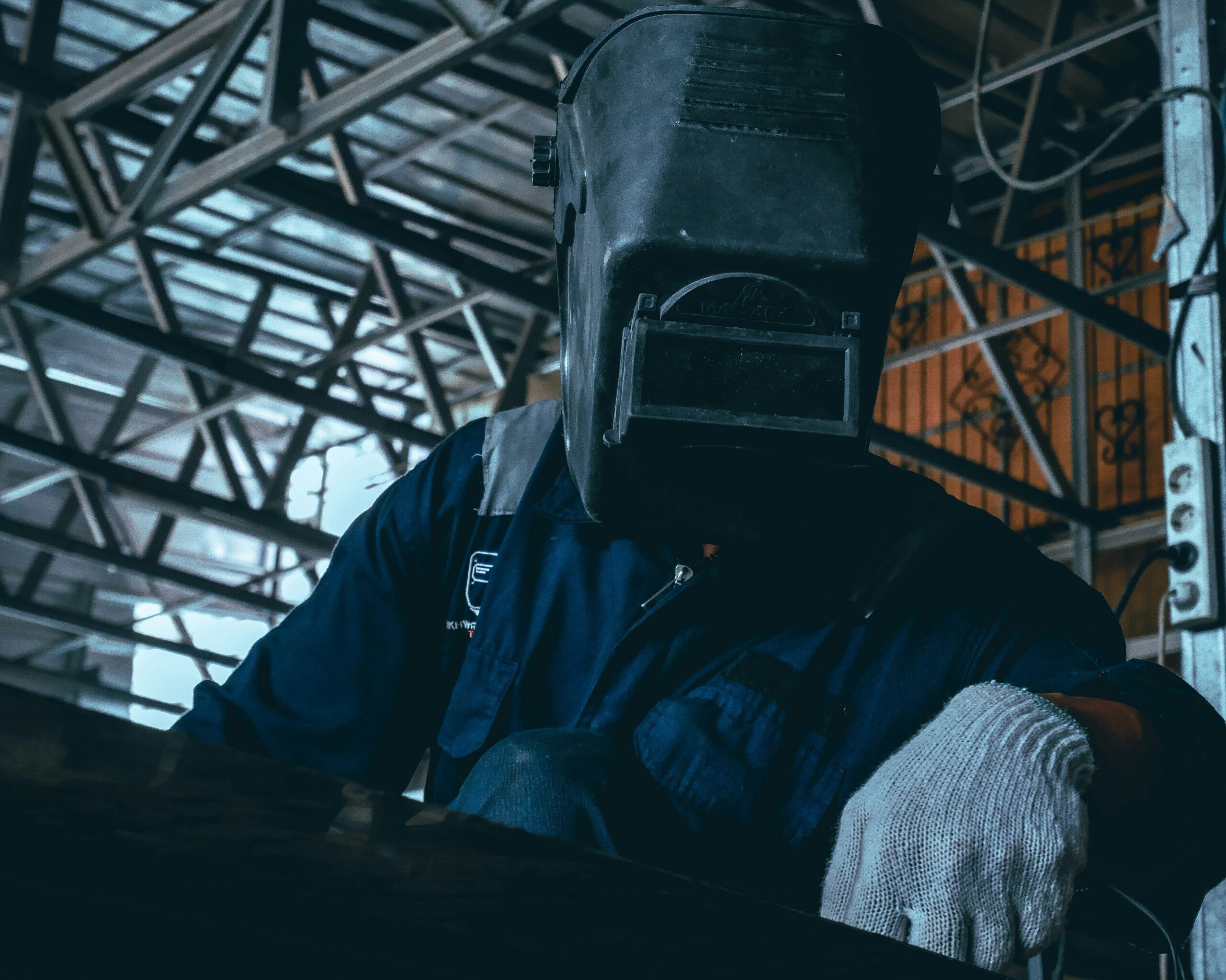 A spill of hazardous chemicals being cleaned by professionals wearing protective gear