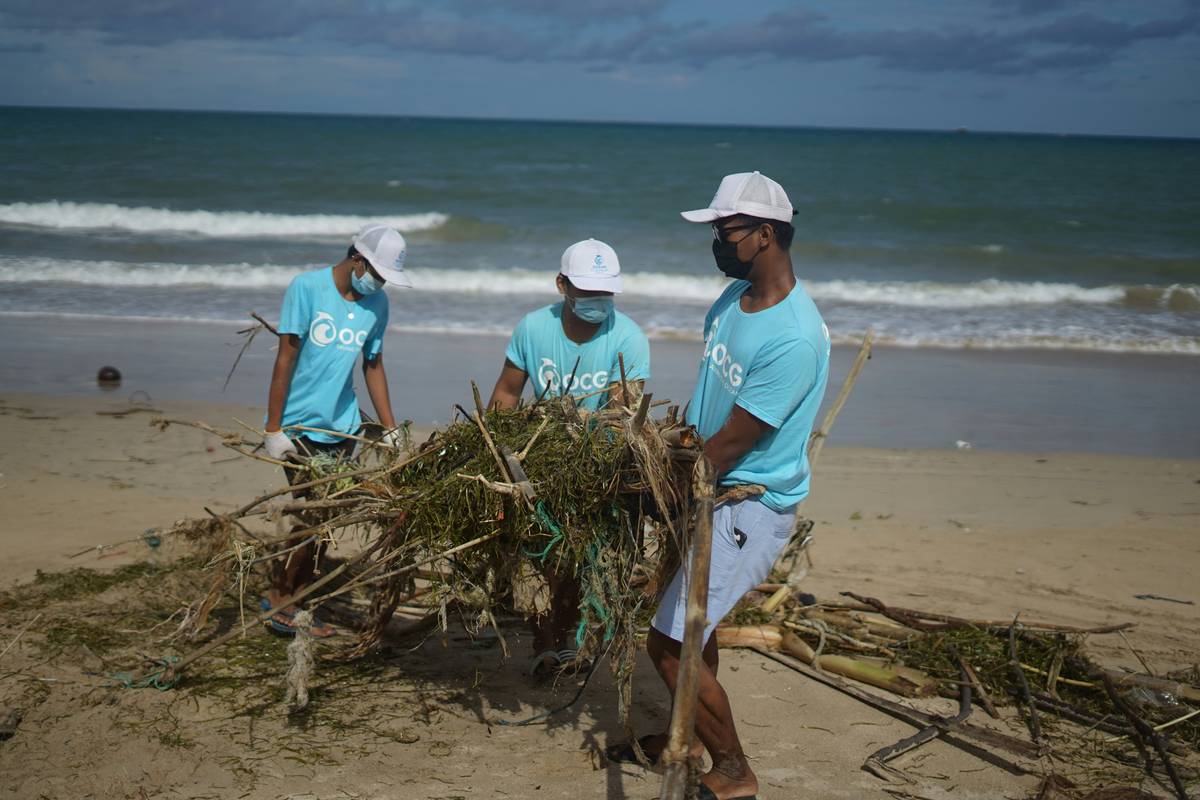 Ocean cleanup group (OCG) remove branches and fishing nets from the beach in Bali. Plastic fishing nets pose a huge problem for the environment and marine life.