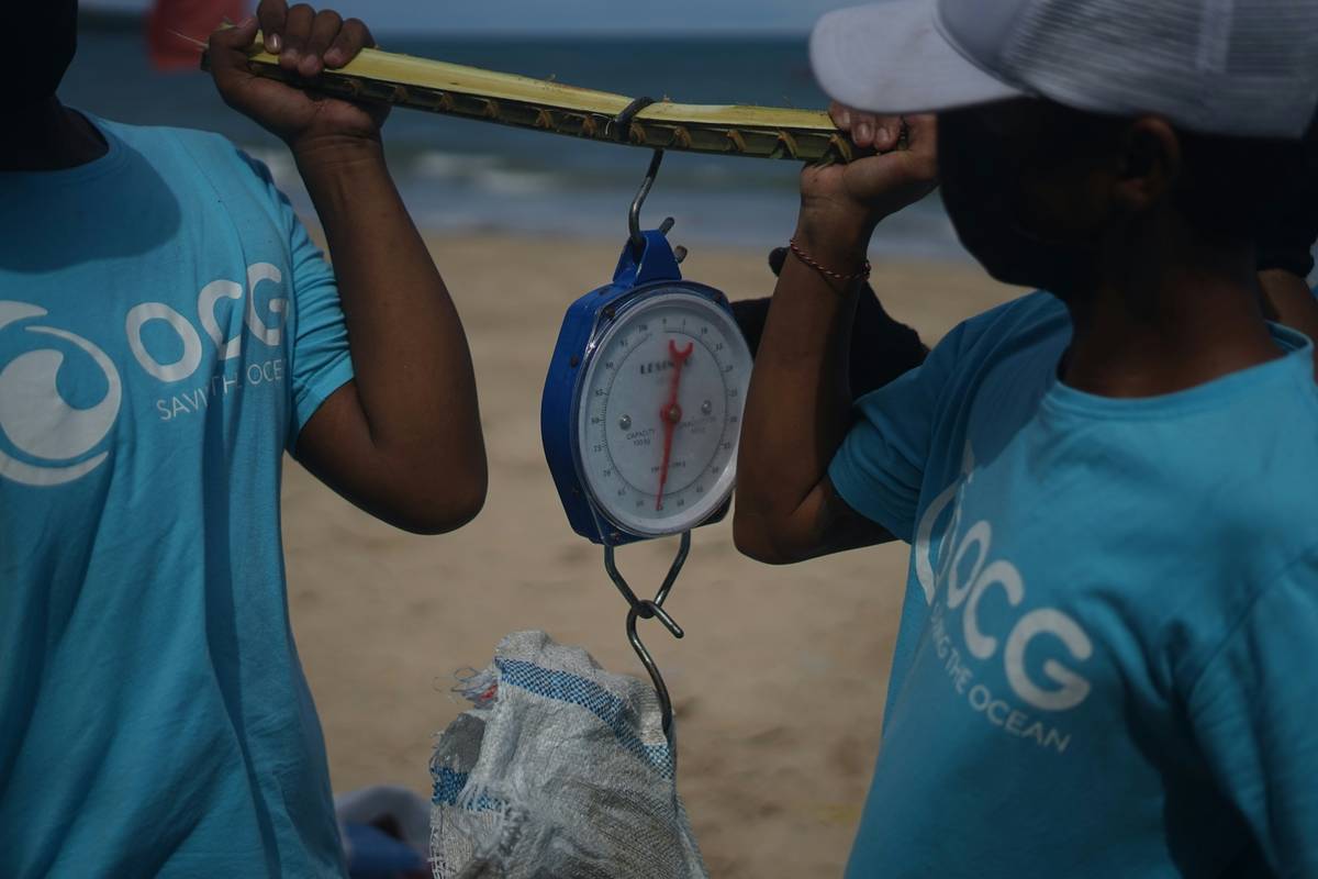 weighing the trash collected