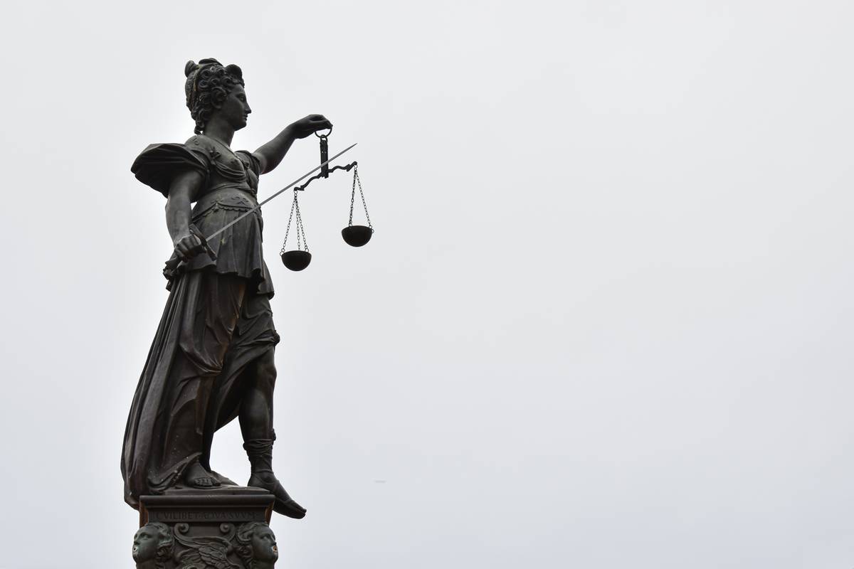 Legal team reviewing environmental damage legal help documents in conference room